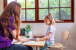 © Austockphoto - Speech therapist professional with child using technology to help with language development