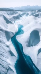 Wall Mural - Aerial view of a turquoise river winding through white sand dunes and mountains.