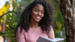© InspirationDesign - Joyful African American student studying outdoors. Perfect for education lifestyle, academic success, and positive learning.