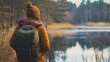 © InspirationDesign - Explorer with backpack by serene lake. Ideal for outdoor adventure, nature connection, and travel lifestyle.