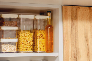 Organization of space in the kitchen cabinet. Organizers for loose products.