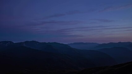 Fototapete - Scenic sunset view over mountains with colorful sky and soft clouds, showcasing nature's beauty at dusk