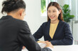 © Pormezz - HR manager interviewing female candidate applicant who recruit job in the office.