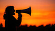 © Wintakorn - Silhouette of person with megaphone at sunset