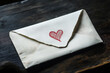 © tynza - Minimalist aesthetic of a love letter half-slipped out of an envelope, with a heart symbol drawn in red ink.