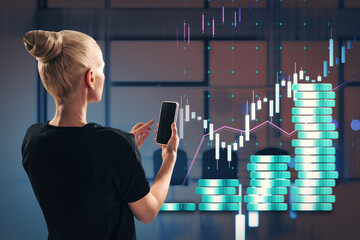 Aufkleber - Woman analyzing financial data on smartphone, with bar charts and coin stacks in modern office background.