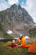 © EVERST - Family travel father and daughter on  camping vacations in mountains, parent and kid hiking together active adventure outdoor dad and child playing on mat healthy lifestyle hobby