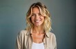 © Maryna - Happy blond woman smiles warmly. Studio portrait. Attractive lady wears casual shirt. Positive expression. Middle-aged female model. Posing for fashion. Stylish look. Pro photo. Excellent for