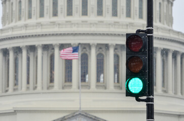 Wall Mural - Green light and Capitol in the snow - Red light symbolized a affirmative resolution from the Capitol