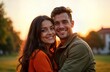 © Maryna - Happy latin couple poses outdoors at sunset. Smiling, hugging close together. Appear affectionate, joyful. Photogenic moment of love, togetherness. Outdoor romantic photo. Latin couple displays