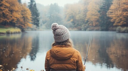 Wall Mural - Woman Fly Fishing in Autumn Landscape