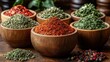 © wisnuromad art - Assorted spices and herbs in wooden bowls.