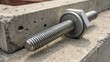 © DigitalSpace - A closeup of a large anchor bolt set in concrete displaying the embedded expansion sleeve and rough texture of the concrete surrounding it with a focus on the bolts threaded area.