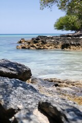 Aufkleber - Serene Tropical Beach With Rocky Shoreline And Crystal Clear Water : Generative AI