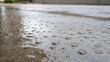 © DigitalSpace - A closeup shot of water pooling on the surface of wet concrete with the texture of the concrete visible beneath the droplets emphasizing the moisture retention needed for strength