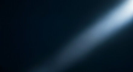 Poster - Light beam shining through dark background creating a dramatic effect