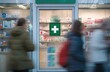 © YONG - A green cross sign is on the door of an emergency pharmacy.