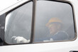 © Parilov - Portrait adult man industry driver in hardhat operate crane or excavator at construction site