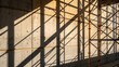 © DigitalSpace - Medium closeup of a sunlightdrenched concrete wall adorned with a complex dance of shadows cast by scaffolding evoking a sense of architectural evolution.