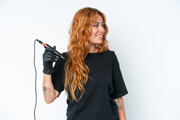 Wall Mural - tattoo artist caucasian woman isolated on white background looking side