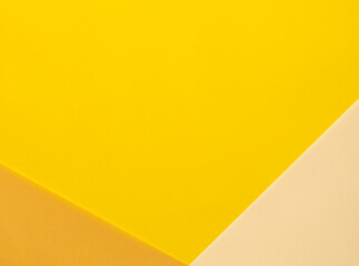 Poster - Bright yellow, beige, and orange paper background with bold, diagonal translucent layers. Vibrant and multicolored, the geometric composition is dynamic, modern, and artistic.
