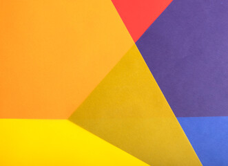 Poster - Colorful geometric paper background with translucent red, yellow, orange, blue, and purple overlapping layers. Multicolored shapes and vibrant contrasts create a dynamic and modern composition.