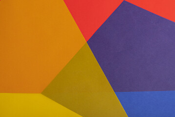 Poster - Colorful geometric paper background with translucent red, yellow, orange, blue, and purple overlapping layers. Bold shapes and vibrant symmetry create a dynamic and modern composition.