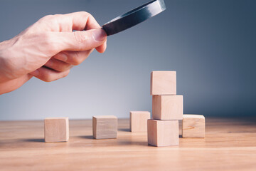 Wall Mural - businessman holding wooden blocks in hand