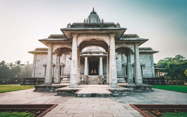 Wall Mural - Majestic stone temple at sunrise, architectural details visible.