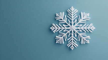 Poster - A single white snowflake on a blue background