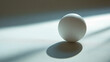 © Your Hand Please - A lone sphere casting a perfect shadow symbolizes perfection and singularity, with a blurred caption space on the side and a bright tone reflecting the contrast with chaos