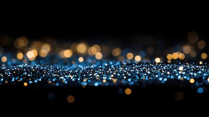 Abstract bokeh background with dark blue and gold glitter.