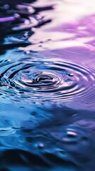 Poster - Close-up view of concentric ripples expanding outwards from the point of impact of a water droplet on a vibrant, colorful liquid surface, showcasing fluid dynamics and wave propagation