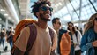 © AN STOCK - On a sunny summer day, a group of young professionals with stylish backpacks and sunglasses laugh and chat as they walk through a bustling airport terminal