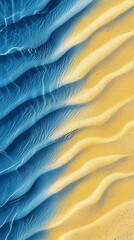Poster - Clear water gently flowing over rippled sand creates a mesmerizing gradient effect, blending shades of blue and yellow in a harmonious composition