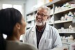 © nsit0108 - Senior male pharmacist smiling and assisting a female customer in a drugstore