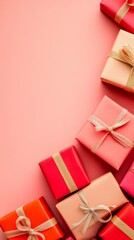 Poster - Colorful valentine's day gifts wrapped in red and gold paper with shimmering ribbons scatter across a pink backdrop, creating a festive atmosphere for celebrating love