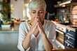 © Marko Geber - Stressed senior woman meditating in kitchen for mindfulness