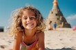 © Igor - Little girl playing on the beach with pyramid in background, shallow DOF