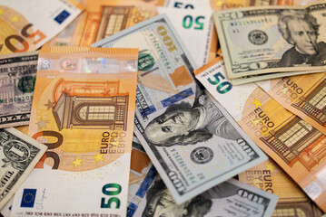 Poster - Assortment of Euro and US dollar banknotes spread out. Represents currency exchange and international financial markets 