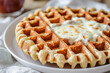 © ShafiAzim - An almond flour waffle pizza is served on a plate. (Generative AI)