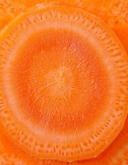 Wall Mural - Vibrant orange carrot slices, a healthy and delicious treat.