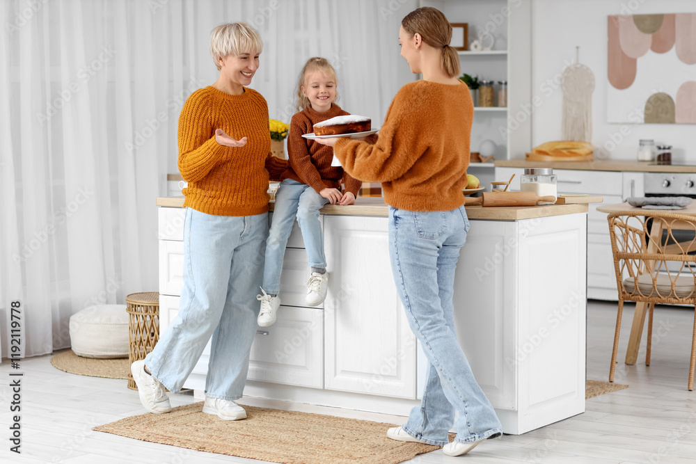 Happy family with tasty pie in kitchen