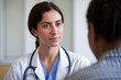 © Emanuel - Female doctor consulting with a patient, representing compassion and expertise