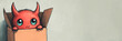 © Khaligo - Cute little red devil hiding in cardboard box