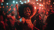 © O - Joyful african woman dancing at night club party with colorful lights