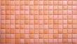 © hardvicore - Peach color square tile background. Flat lay.