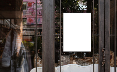 Wall Mural - White paper poster mockup displayed outside the building restaurant. Marketing and business concept.