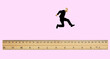 © Westend61 - Concept illustration of an elderly man jumping over a ruler
