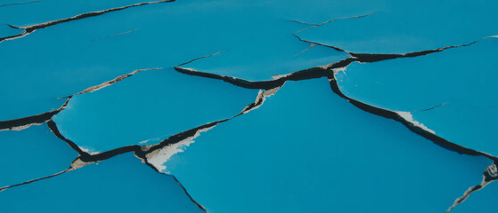 Aufkleber - Textured surface with cracked paint in vintage blue tones revealing aged elements and character